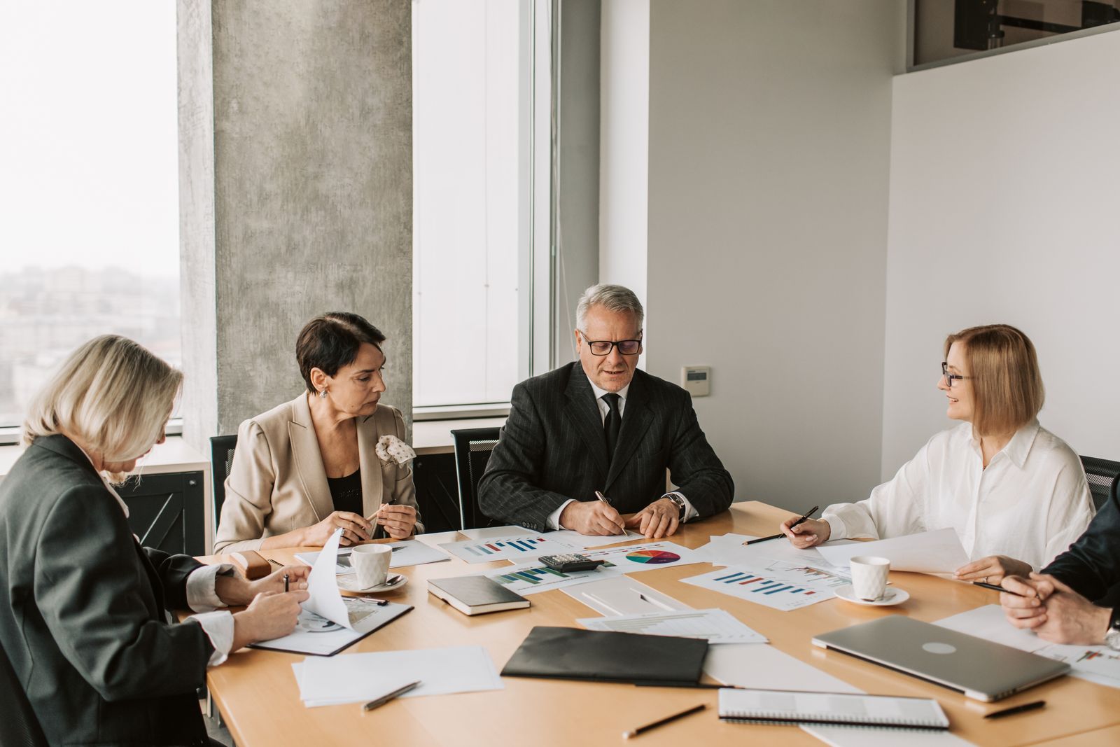 International business team reviewing Korean patent filing documents