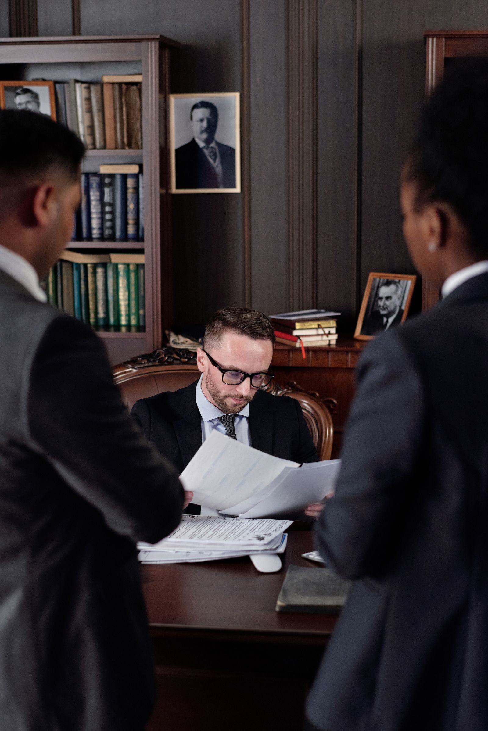 Legal team reviewing documents for Korean patent infringement litigation