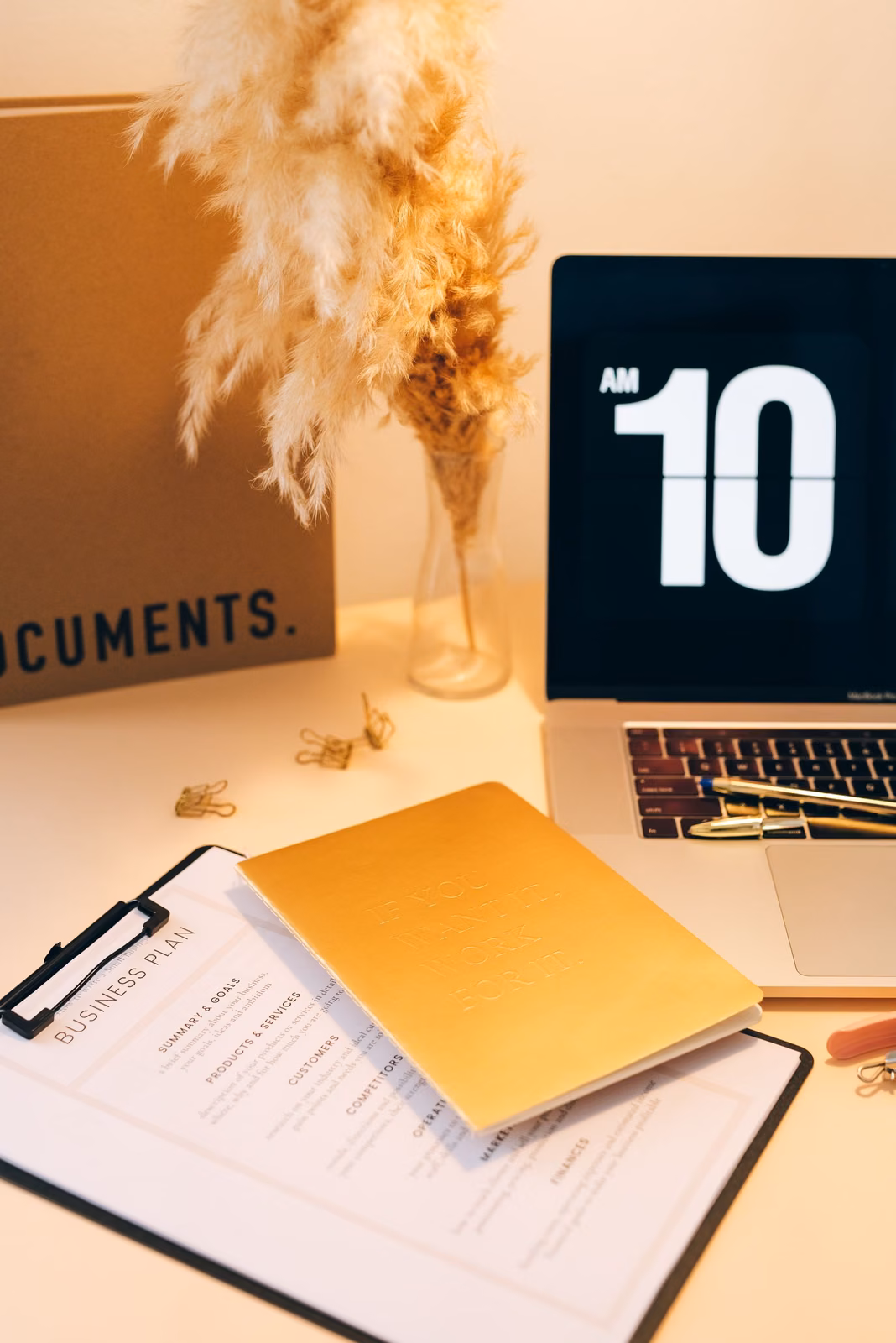 Patent portfolio planning documents and laptop on an office desk